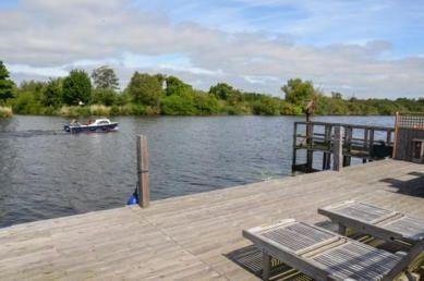 River Yare view from the decking at Swallowdale Holiday Home in Brundall