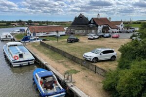 Boats mooring at Acle Bridge Inn in Norfolk