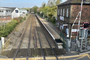 A view from the station bridge showing Brundall train station platform towards Norwich